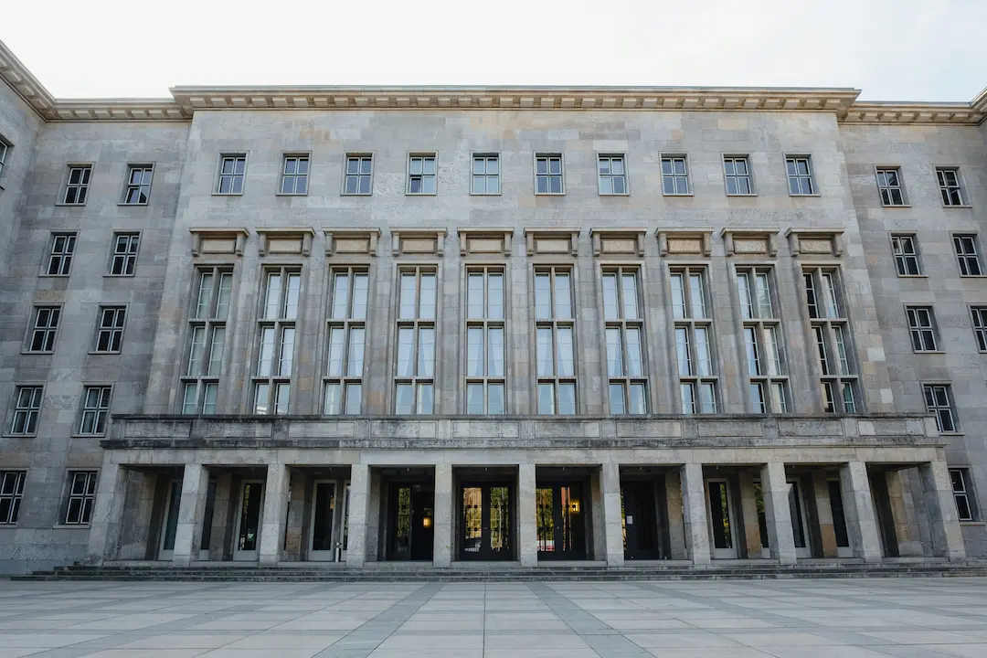 Monumental administrative building with symmetrical facade and columned entrance.